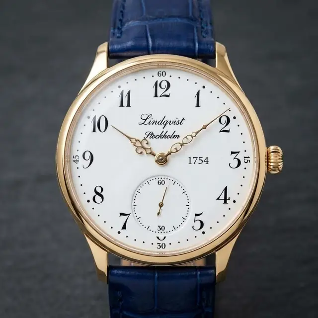 Lindquist 1754 first reference: gold case, white enamel dial with Arabic hours, Lindqvist Stockholm signature, small seconds